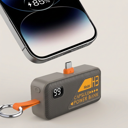 Gray Key Capsule USB-C connector aligned below a phone